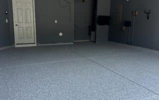 Garage epoxy floor installation in progress benefits of epoxy flooring