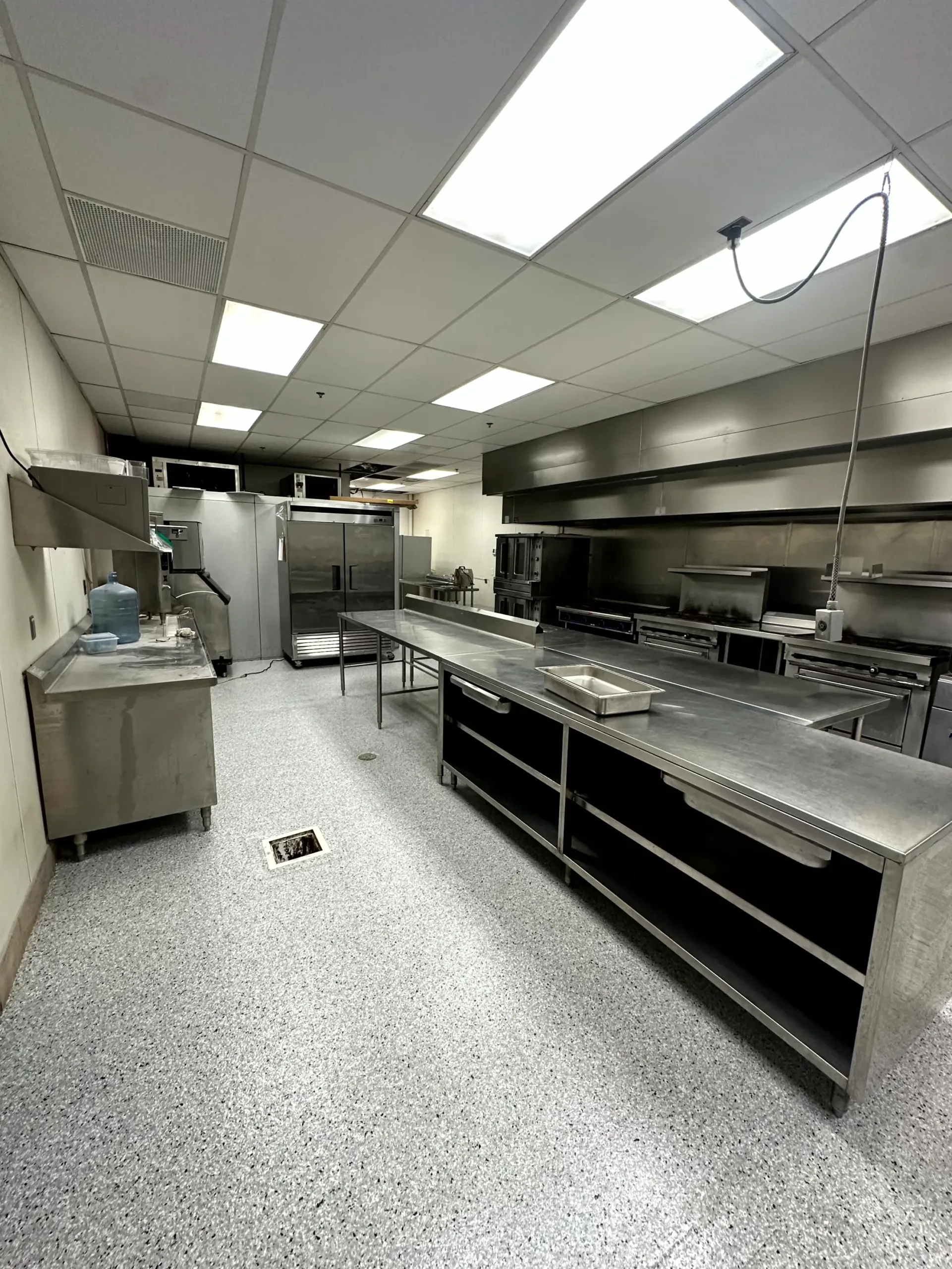 Commercial kitchen with newly installed, clean epoxy floor Commercial kitchen with newly installed, clean epoxy floor